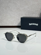 Chrome glasses with dark lenses and silver-tone metal frame, round oversized shape