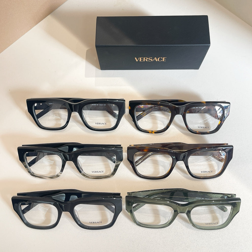 Three-pair eyeglasses set with clear lenses and patterned frames, with Versace logo box