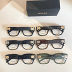 Set of three eyeglasses frames with patterned temples and clear lenses, with Versace box
