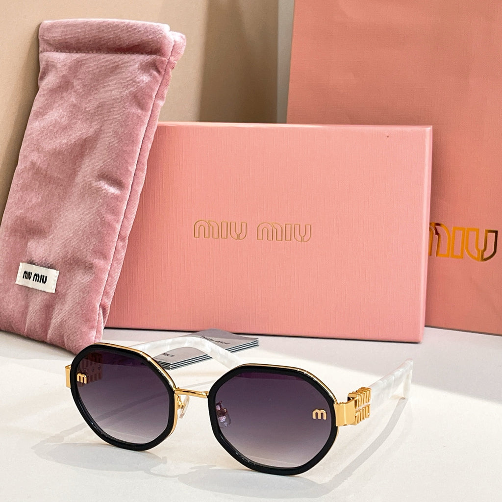 MiuMiu round sunglasses with dark frames and gold-tone logo arms