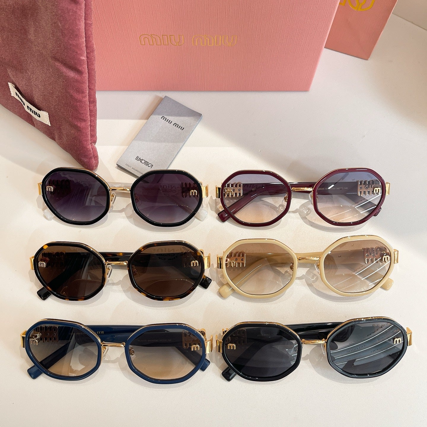 MiuMiu sunglasses set with mixed frame colors in a neat row