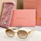 MiuMiu round sunglasses with gold frames and gold-tone logo arms