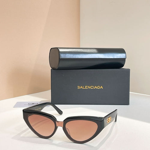Balenciaga sunglasses with dark frames and pink-tinted lenses, gold logo temple detail