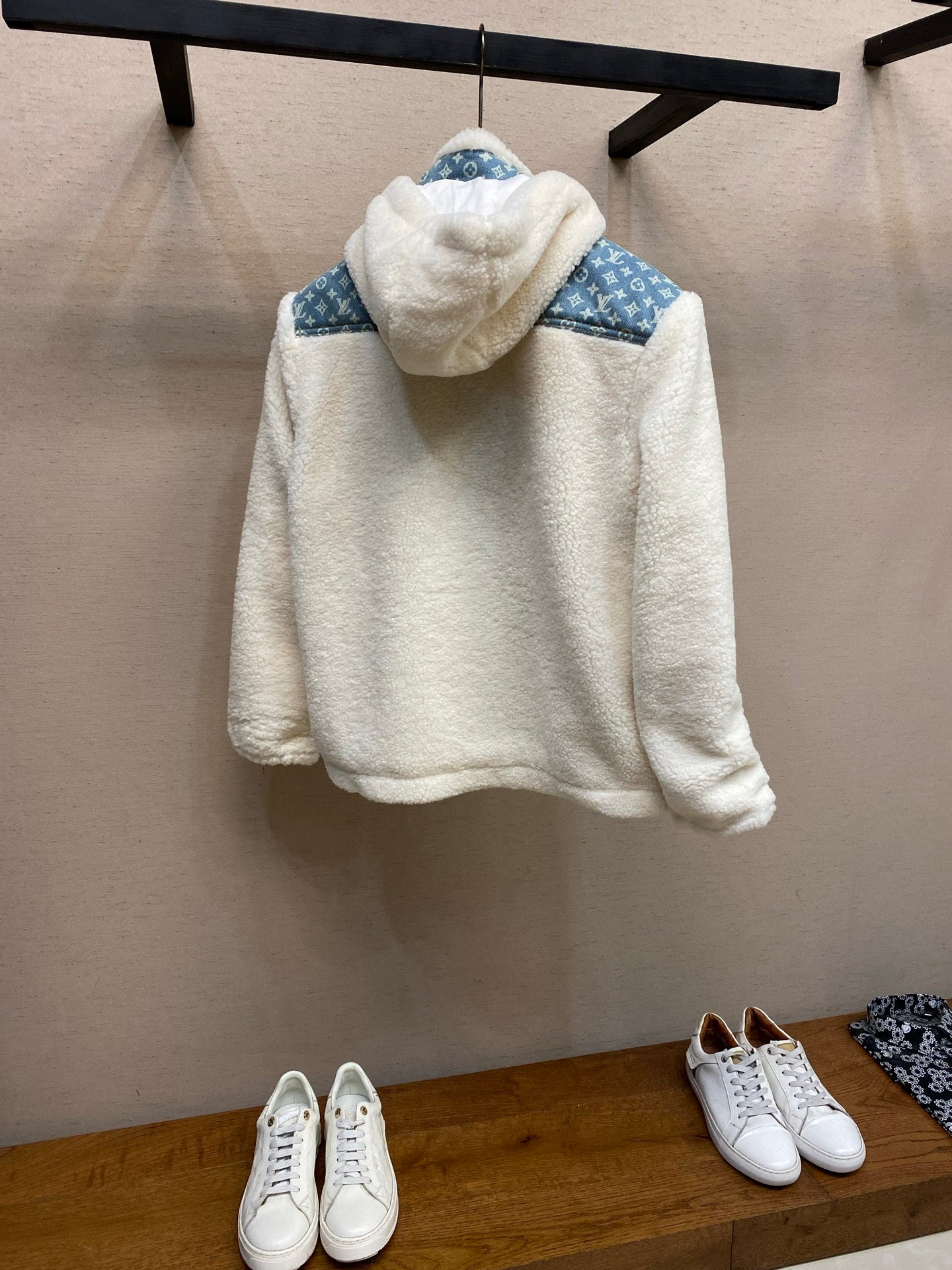 White sherpa hooded jacket with blue monogram yoke