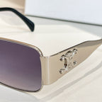 Square sunglasses with purple tinted lenses and silver metal arms