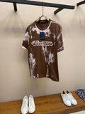 Louis Vuitton short-sleeve T-shirt in dark brown with white splatter print and script logo