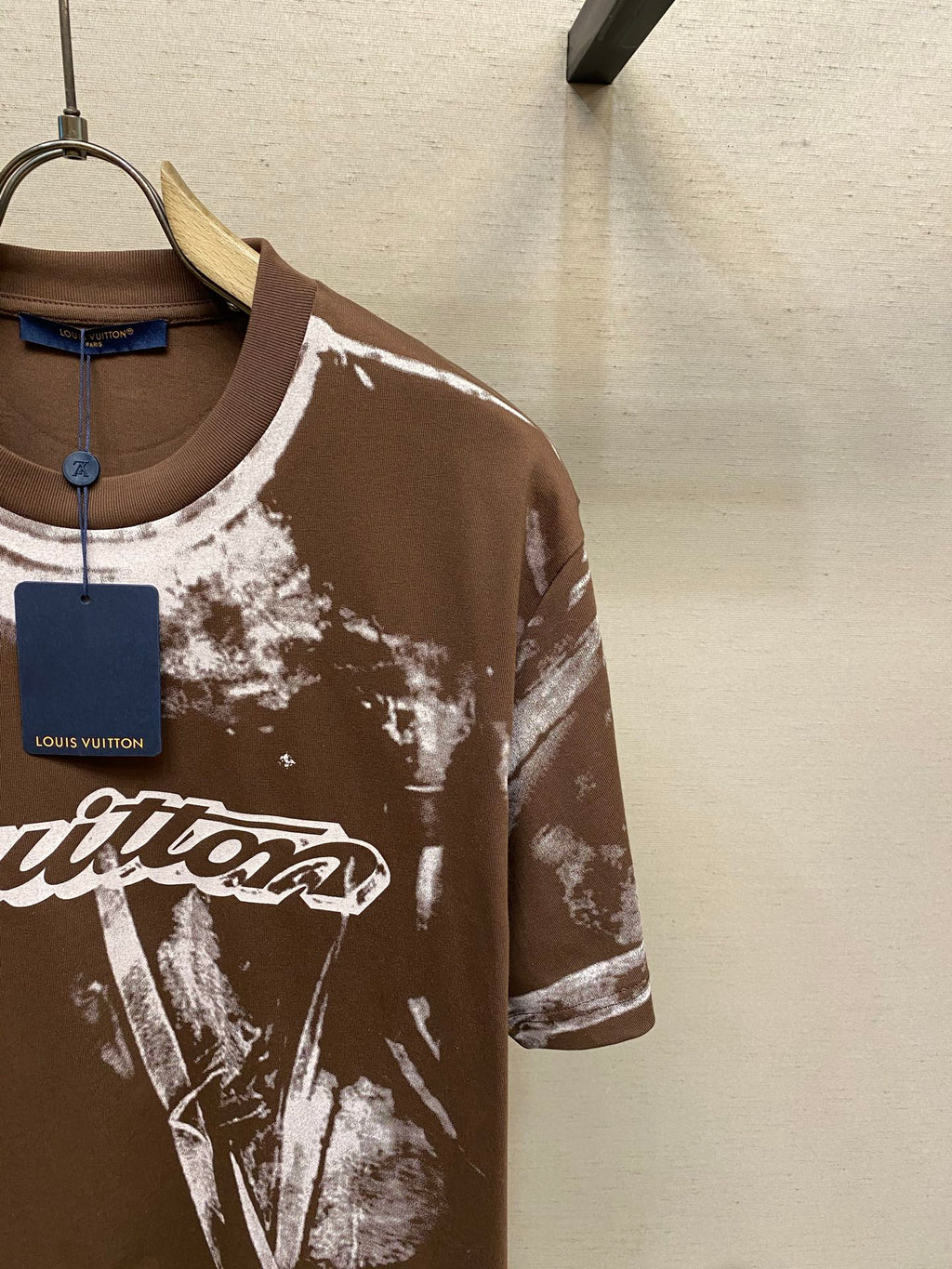 Louis Vuitton short-sleeve T-shirt chest with white splatter print and script logo on dark brown