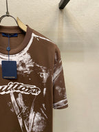 Louis Vuitton short-sleeve T-shirt chest with white splatter print and script logo on dark brown