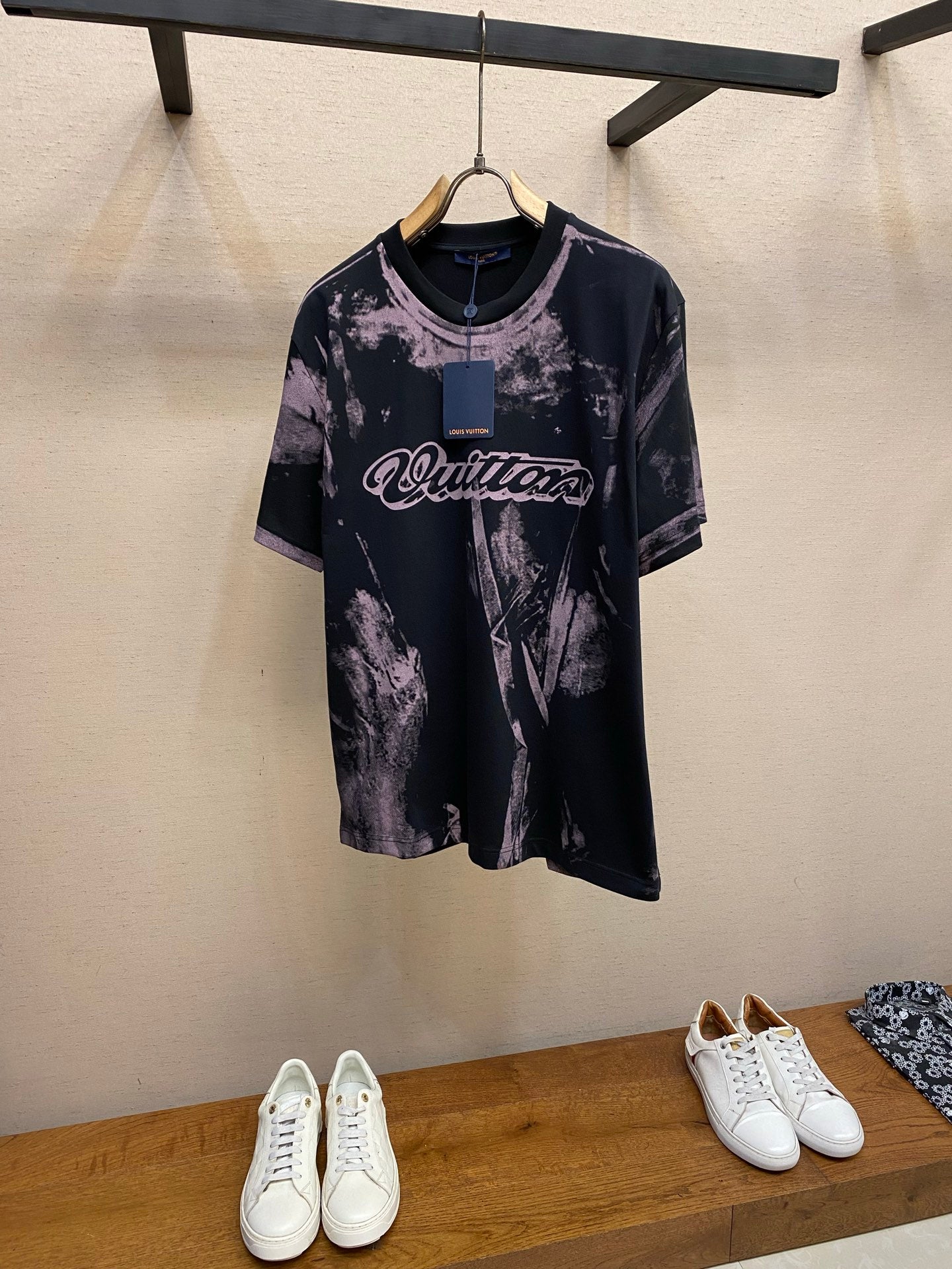Louis Vuitton graphic T-shirt with dark base and purple splatter print, crew neck, short sleeves