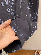 Louis Vuitton dark short-sleeve cuff seam with allover logo print, hand holding