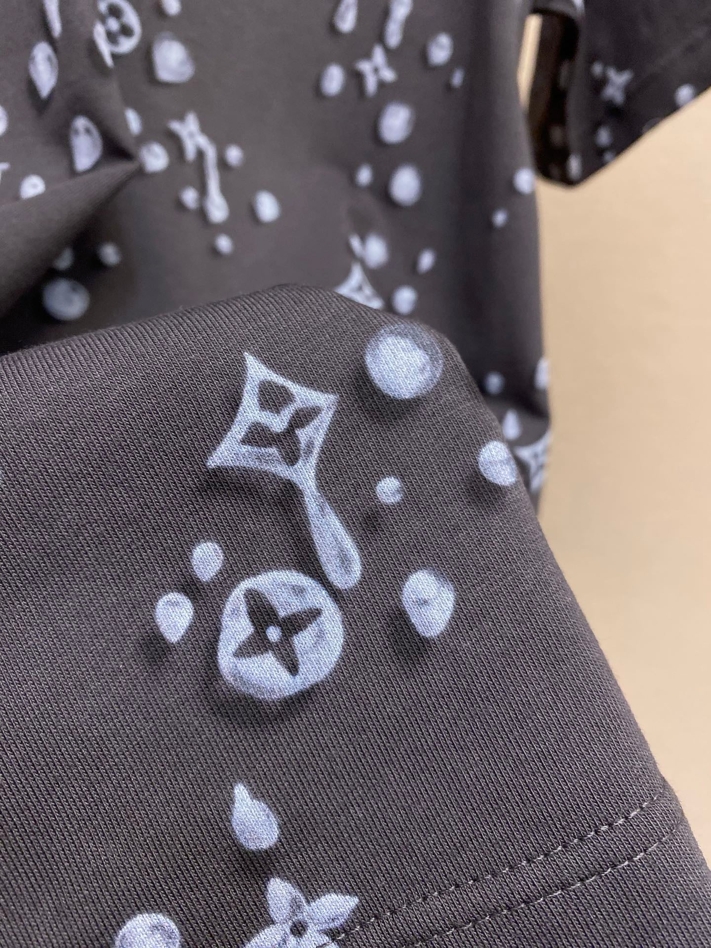 Louis Vuitton dark T-shirt sleeve with stitched hem and allover icon print