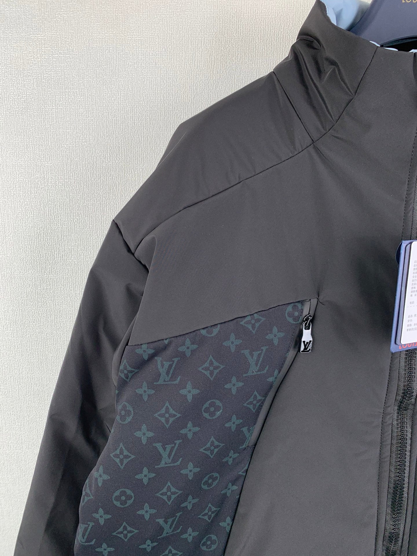 Dark gray hooded jacket with monogram panel detail on sleeve/side.