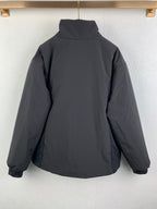 Dark gray hooded zip-up jacket back view, relaxed fit.
