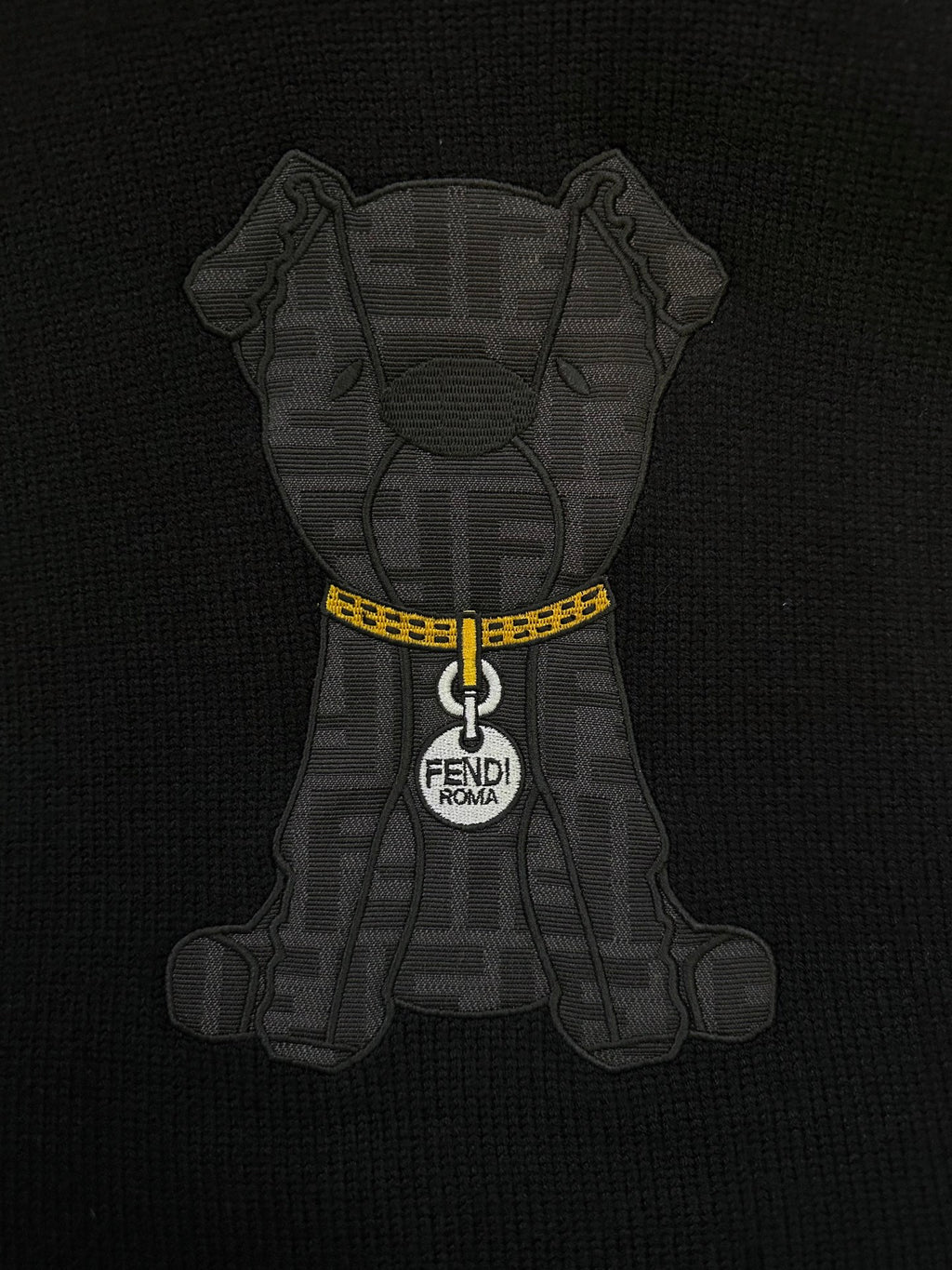 Fendi black sweater featuring gray bear graphic with yellow zipper and FENDI Roma tag