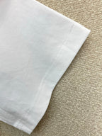 White T-shirt sleeve hem with stitched edge