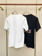 White Versace T-shirt hanging on a hanger, back view