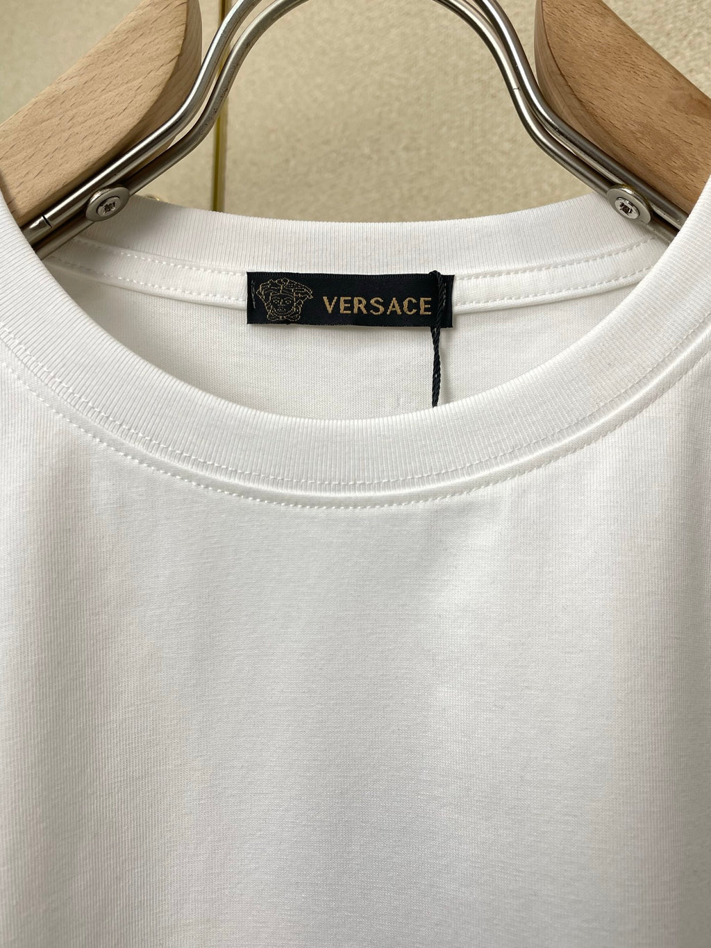 White T-shirt neckline with Versace neck label