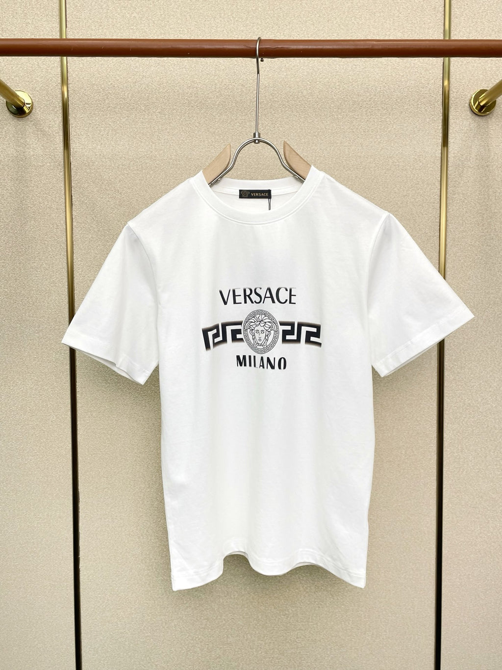 White Versace crewneck T-shirt with centered logo graphic and 'MILANO'