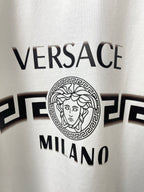 White T-shirt logo close-up with VERSACE and MILANO text and emblem