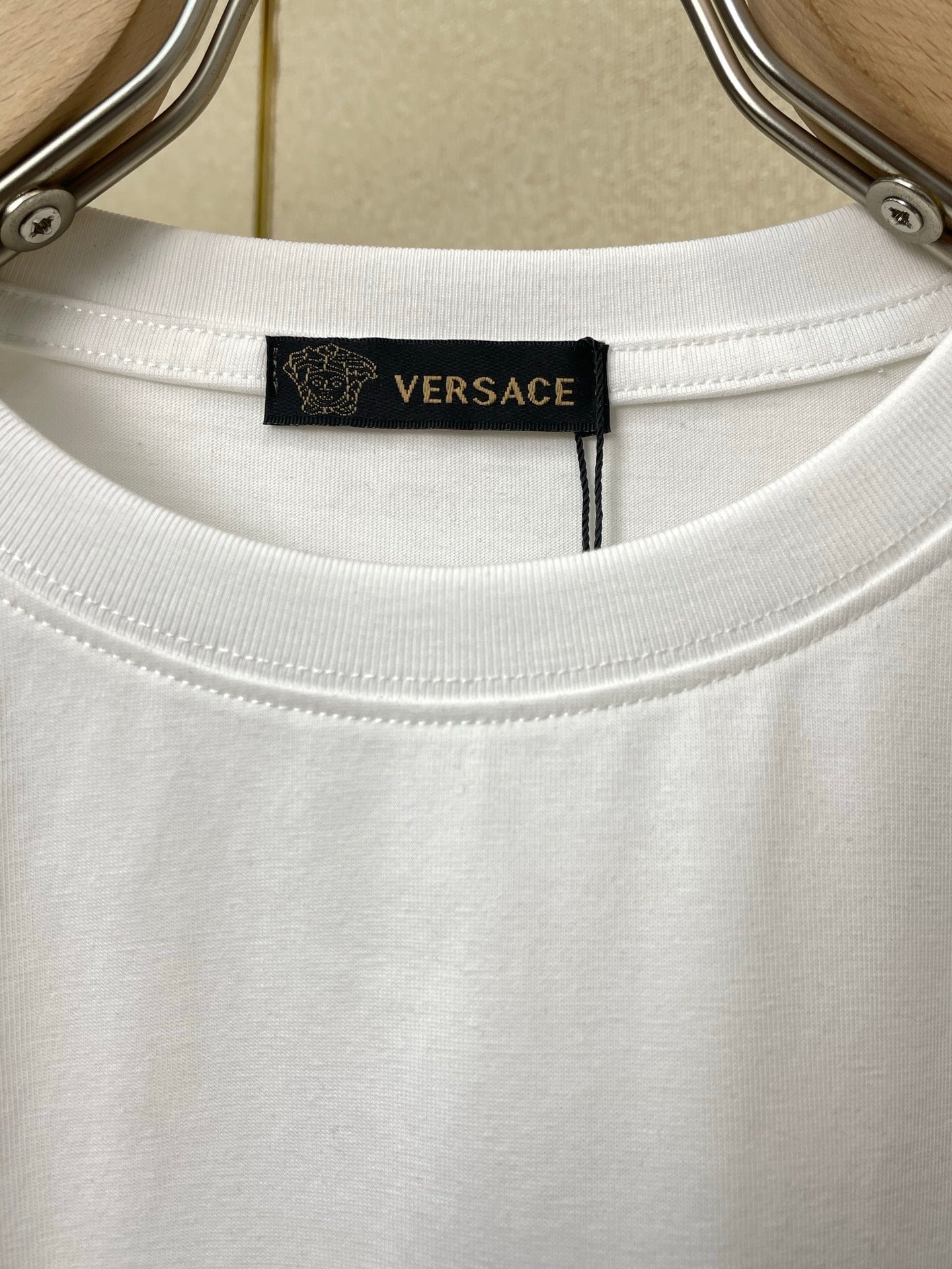 White Versace crewneck T-shirt neckline with branded inner neck label