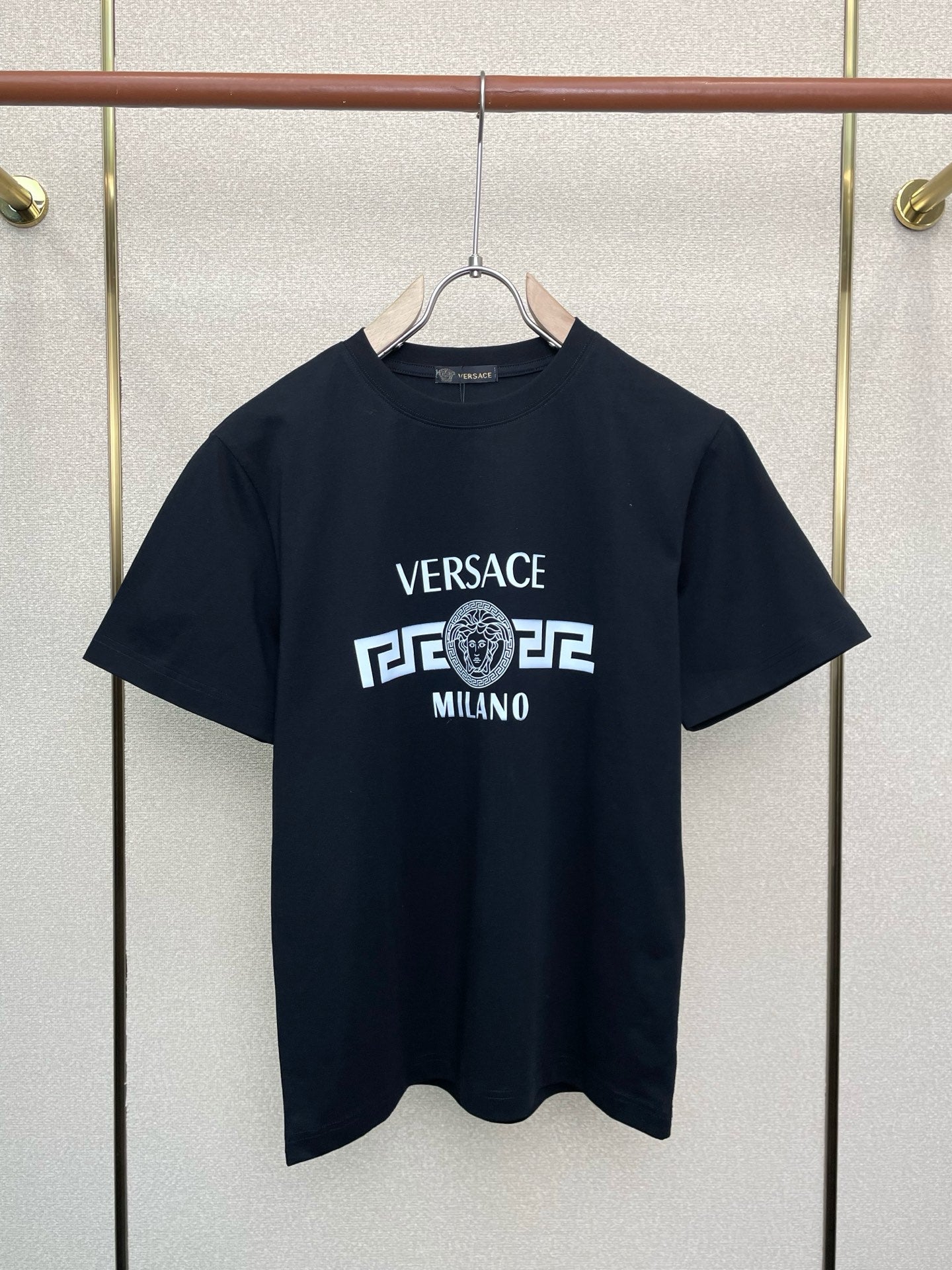Navy short-sleeve T-shirt with Versace Milano logo graphic on front