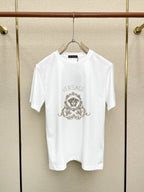 White Versace crewneck T-shirt with VERSACE word and ornate crest print