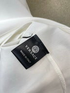 White T-shirt with black Versace 'Made in Italy' size tag