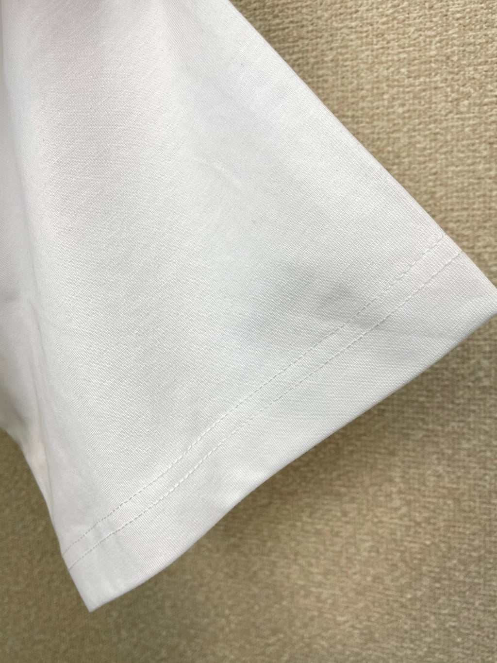 Versace white T-shirt sleeve and side seam detail