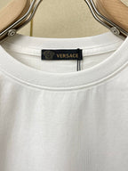 White Versace T-shirt neckline with brand label inside collar.