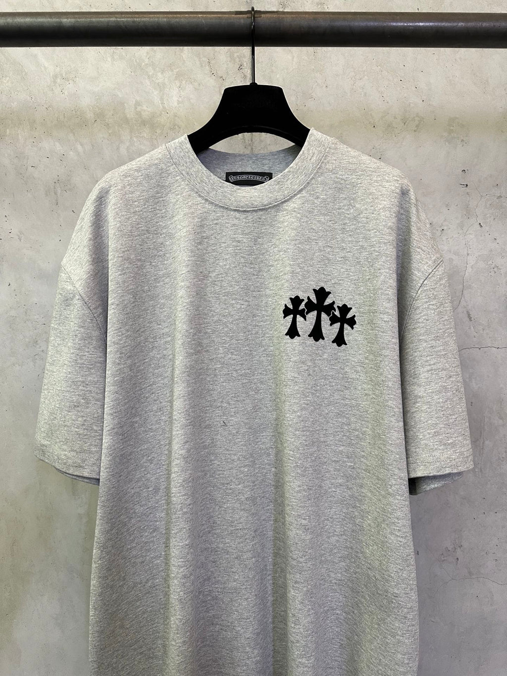 Heather gray graphic T-shirt with black chest logo
