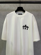 White short-sleeve T-shirt with black cross-style logo on the front.