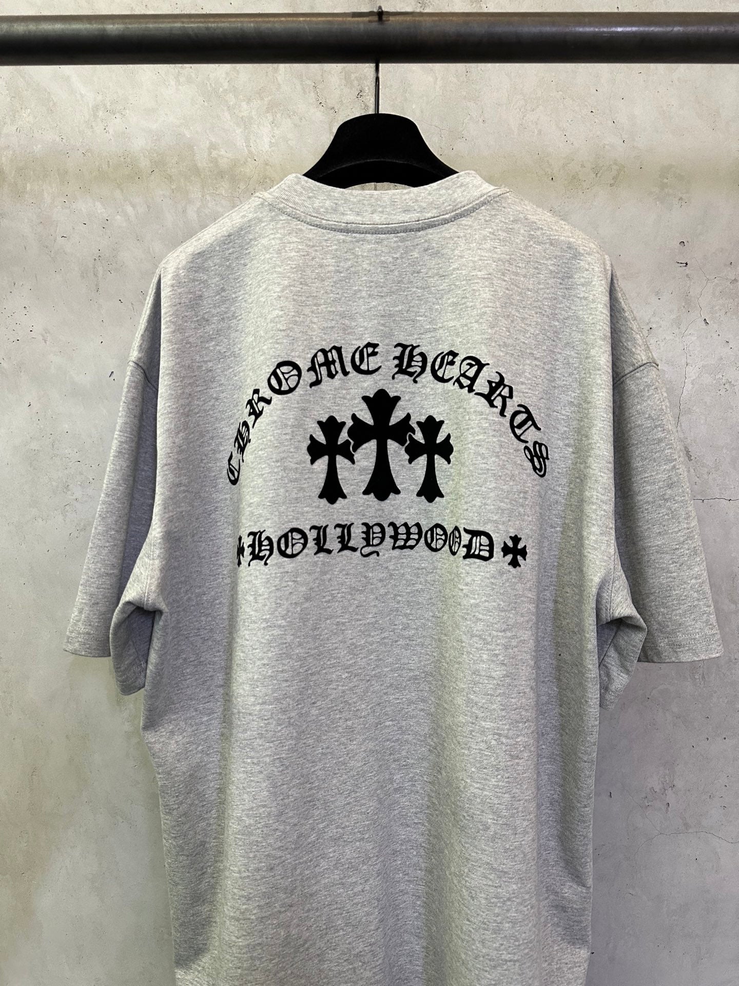 Heather gray T-shirt with large black back text and cross logo