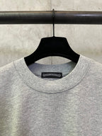 Heather gray crewneck T-shirt with black neck label