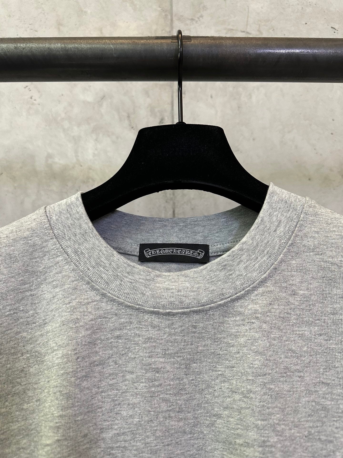 Heather gray crewneck T-shirt with black neck label