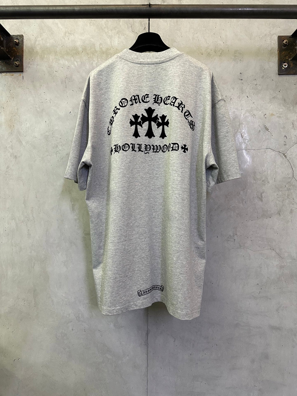 Light gray short-sleeve T-shirt with large black back graphic and lettering