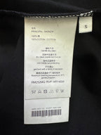 Black T-shirt size S care label with cotton content and washing instructions