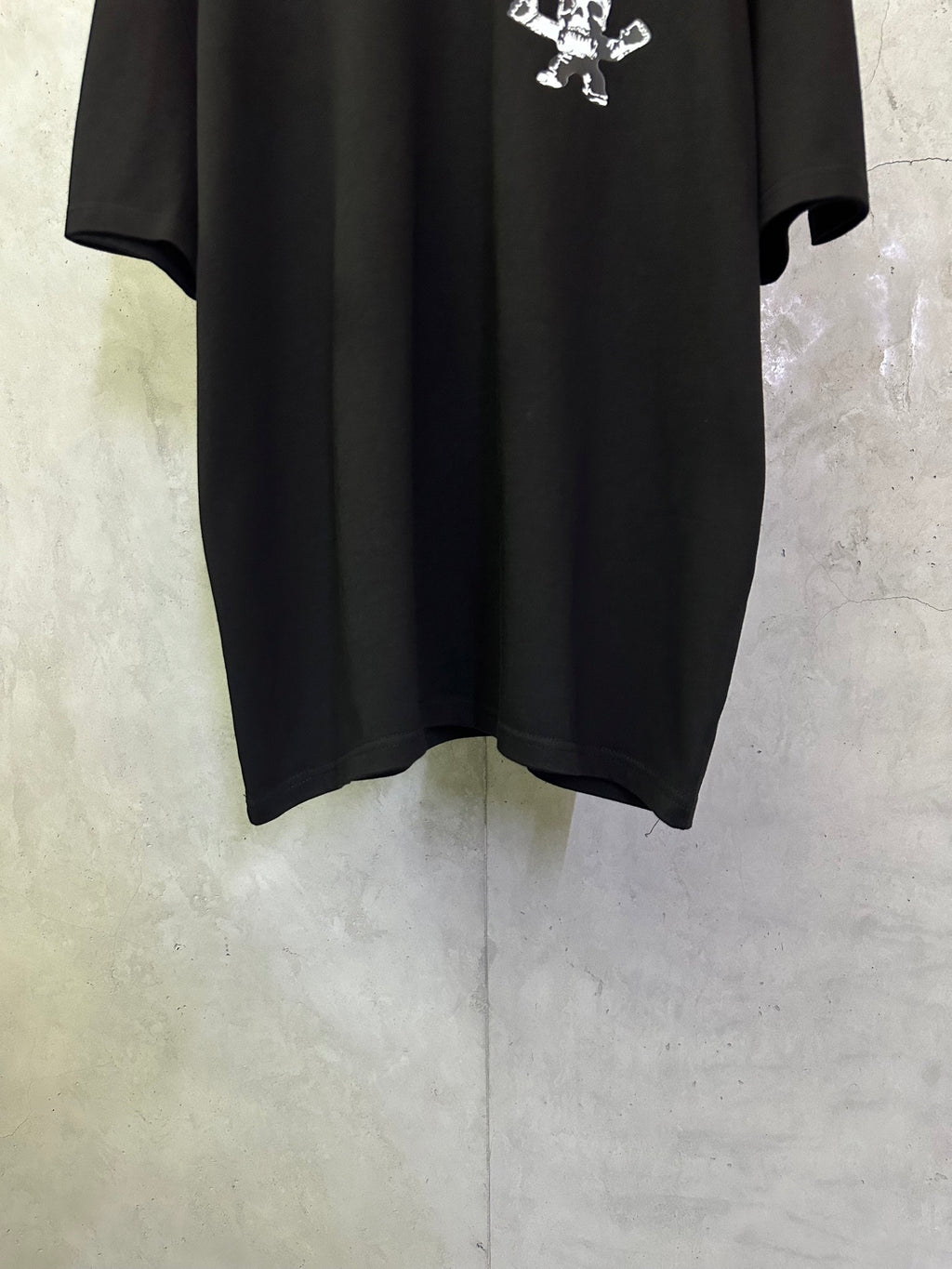 Black crewneck T-shirt front lower hem and short sleeves