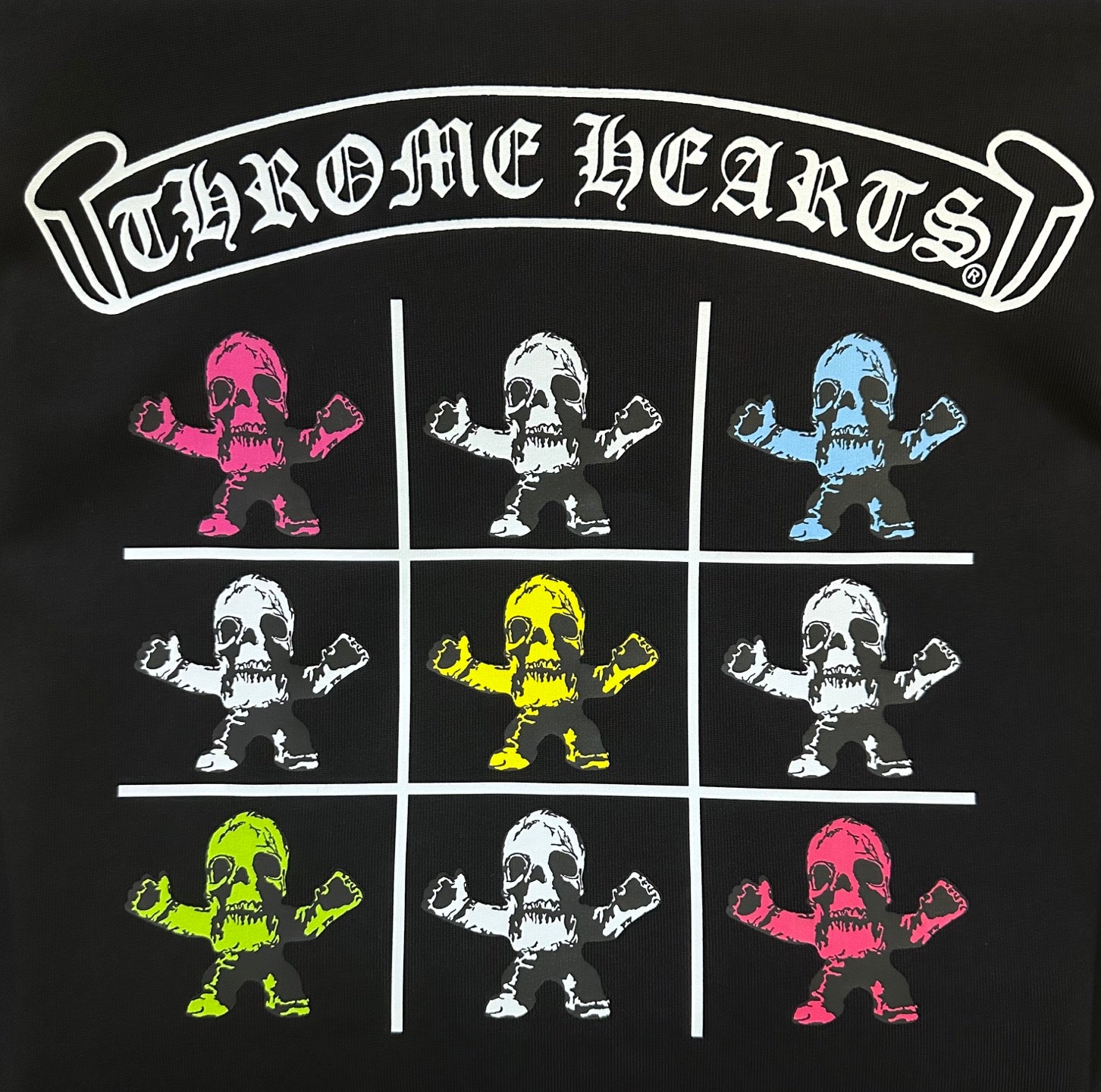 Black T-shirt with 'Chrome Hearts' arched logo and colorful skeleton grid print