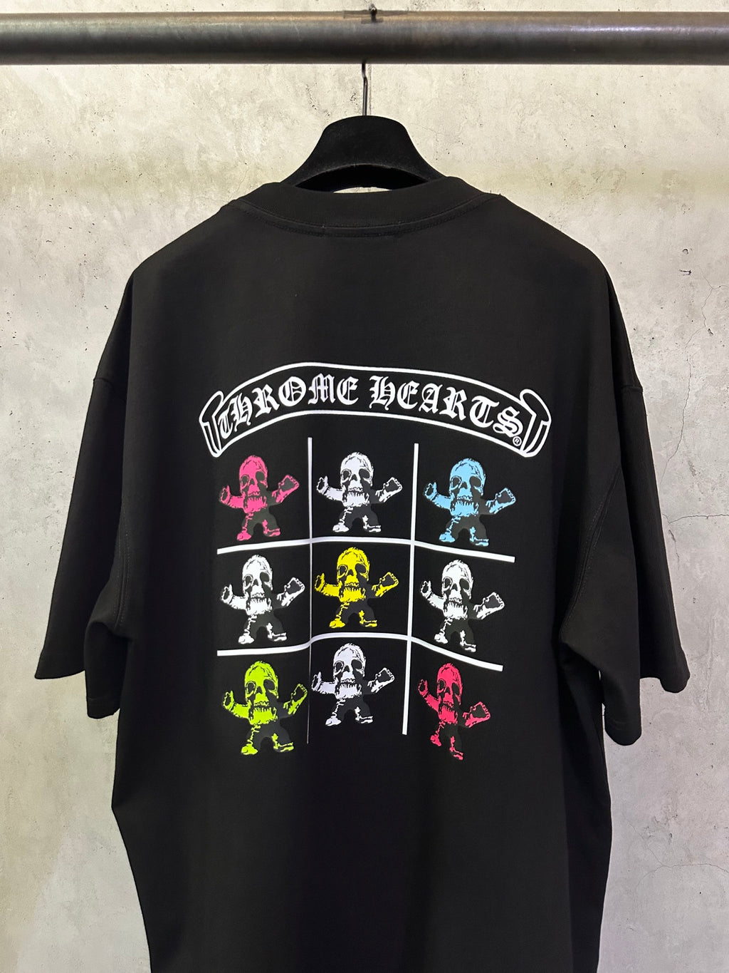 Black crewneck T-shirt back with large 'Chrome Hearts' skeleton grid graphic