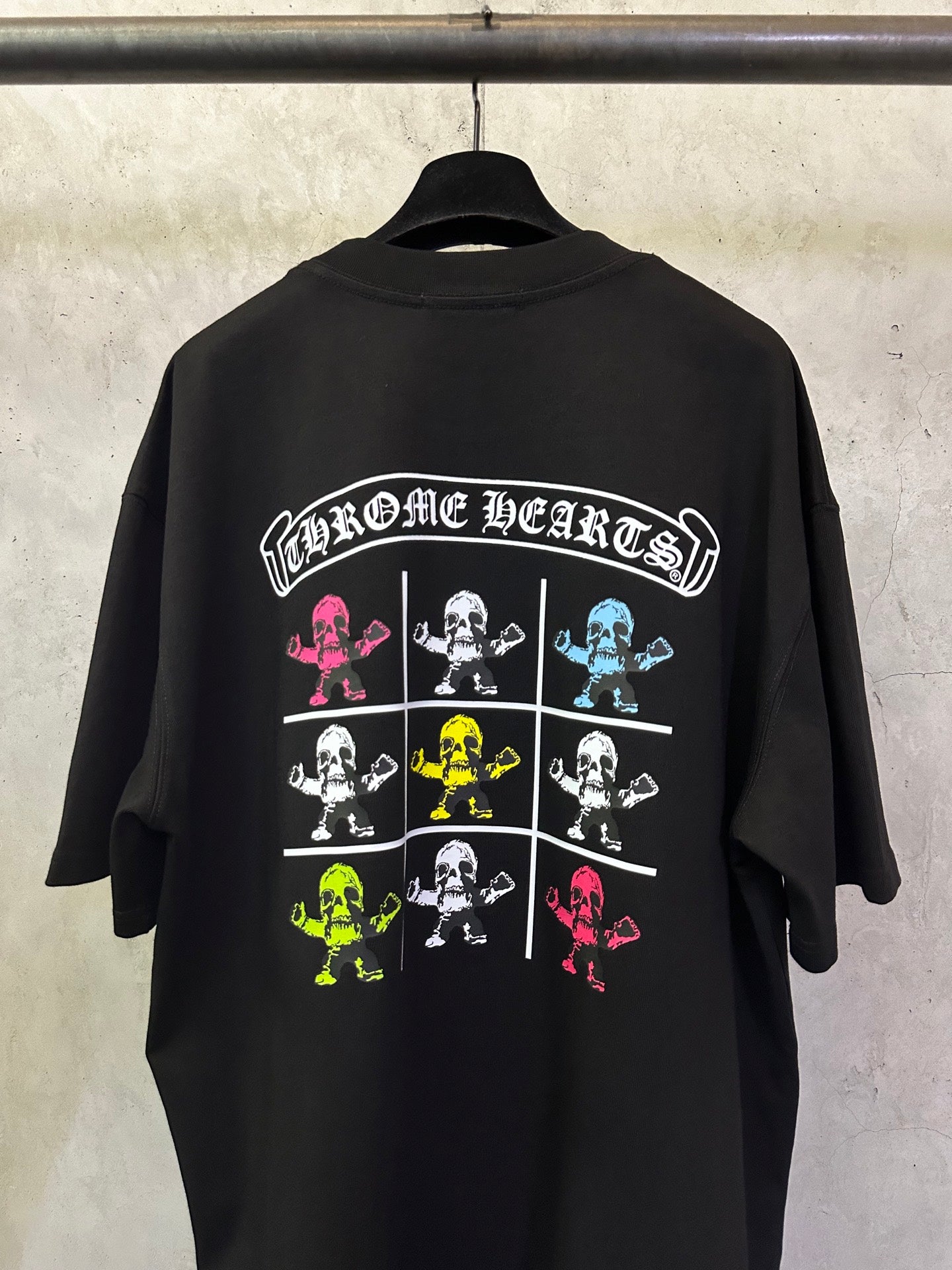Black crewneck T-shirt back with large 'Chrome Hearts' skeleton grid graphic