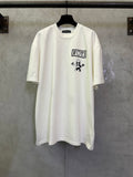 Light short-sleeve T-shirt with FOTI logo and cartoon figure graphic on chest