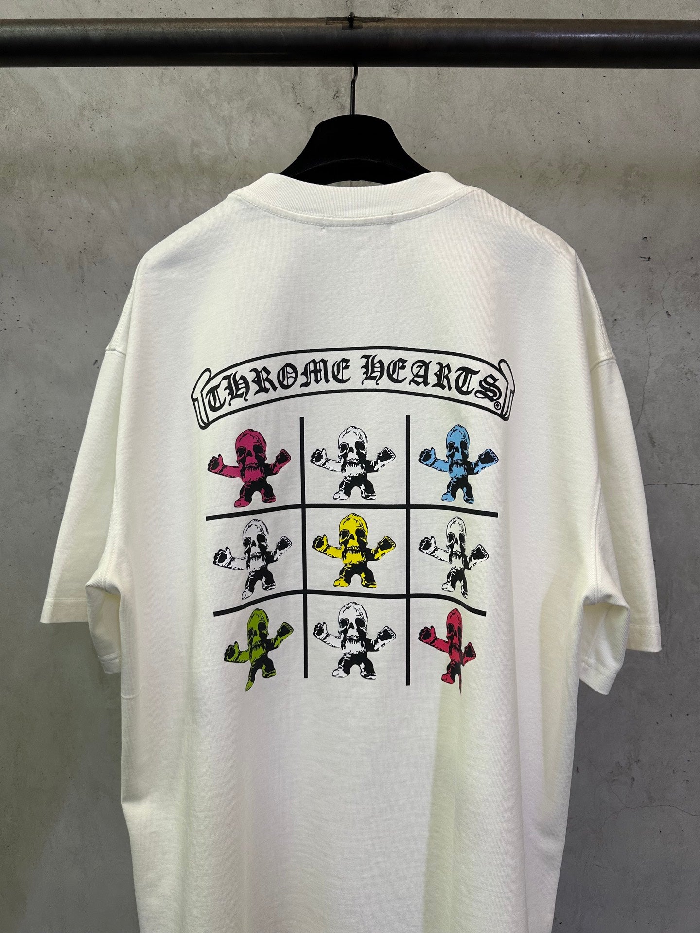Light short-sleeve T-shirt with CHROME HEARTS-style text and figure grid on back