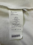 White T-shirt care label tag with text and model details.