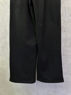 Black Balenciaga track pants with elastic waistband and wide leg openings