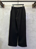 Black Balenciaga track pants with elastic waistband and wide legs