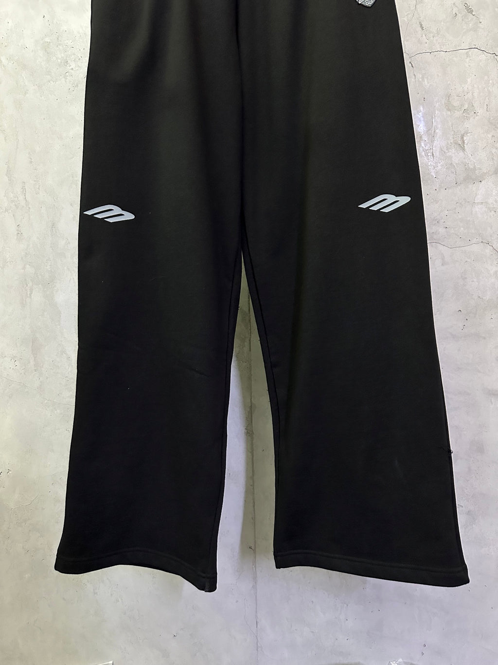 Black Balenciaga track pants with white side logo prints