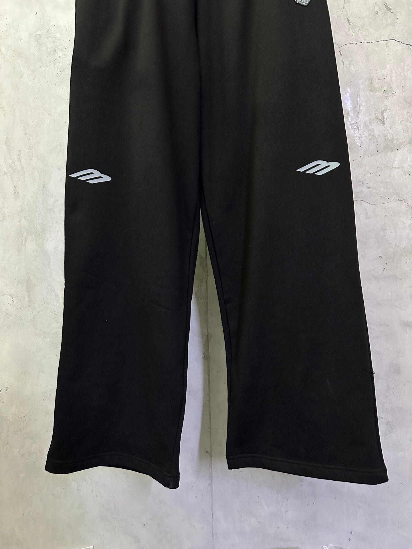 Black Balenciaga track pants with white side logo prints