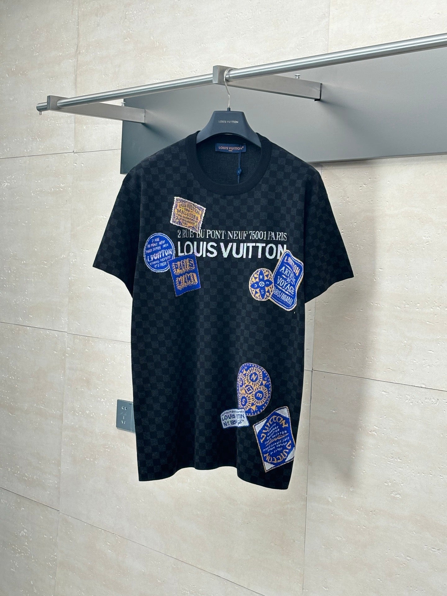 Louis Vuitton checkered knit polo shirt with blue graphic patches