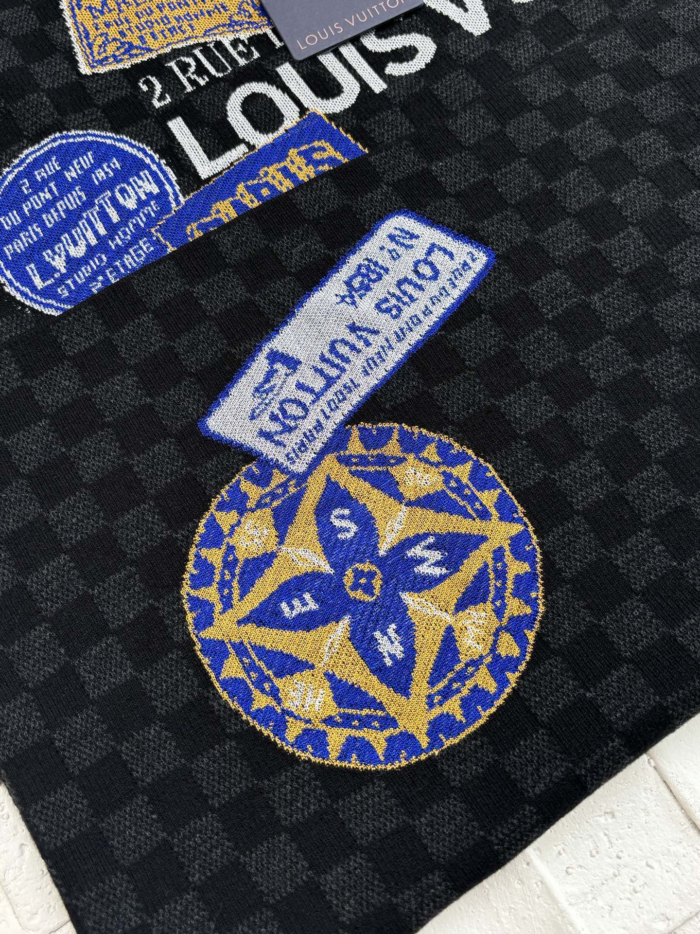 Louis Vuitton knit polo with blue-and-yellow embroidered emblem patches