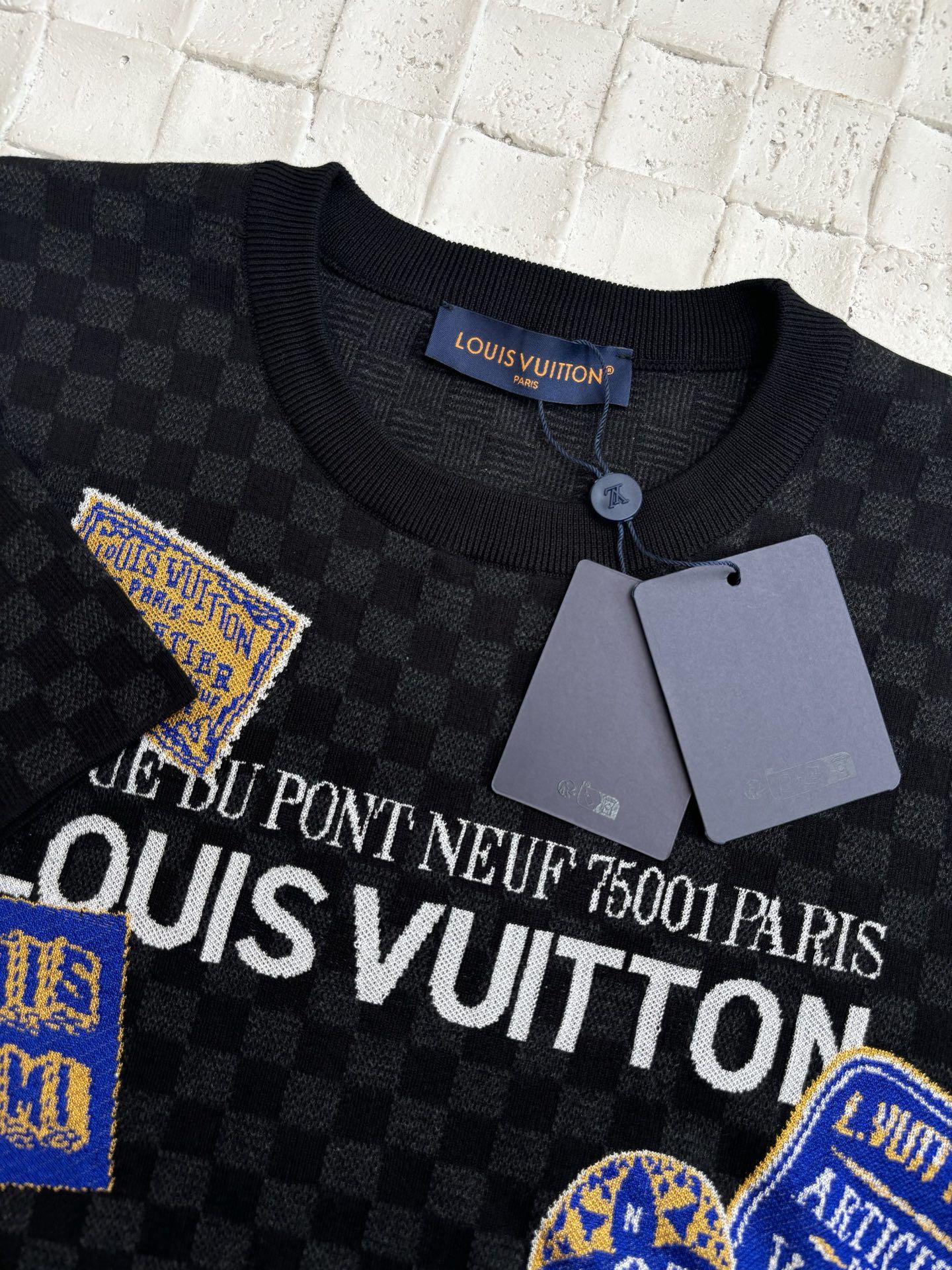 Louis Vuitton knit polo collar with button and black checkerboard graphic print